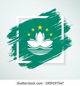 Brush flag of Macau with grunge abstract brush stroke on white frame background