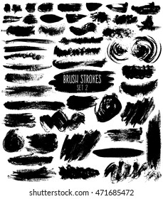 Brush hatches set. Black painted elements of unusual shapes on white background. Expressive isolated brush strokes.