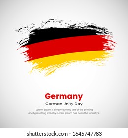 Brush painted grunge flag of Germany country. German unity day of Germany. Abstract creative painted grunge brush flag background.