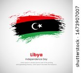 Brush painted grunge flag of Libya country. Independence day of Libya. Abstract creative painted grunge brush flag background.