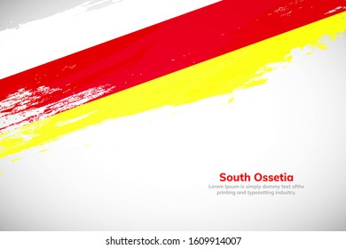 Brush painted grunge flag of South Ossetia country. Hand drawn flag style of South Ossetia. Creative brush stroke abstract concept brush flag background.