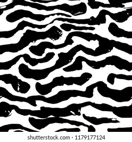 Brush painted zebra seamless pattern. Black and white stripes grunge background.