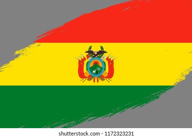 Brush stroke background with Grunge styled flag of Bolivia