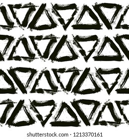 Brush strokes background from triangles. Grunge seamless pattern. Sketchy hand drawn graphic print. Black and White background. Grungy decoration. Vector design. Distress texture