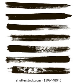 Brush strokes. Paint lines grunge collection. Set of black grungy hand painted brush strokes isolated on white. Abstract ink texture, mascara smudge, makeup eye pencil set.
