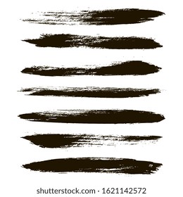 Brush strokes. Paint lines grunge collection. Set of black grungy hand painted brush strokes isolated on white. Abstract ink texture, mascara smudge, makeup eye pencil set.