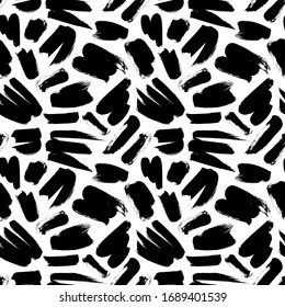 Brush strokes vector seamless pattern. Black paint freehand scribbles, rough shapes, dry brush stroke texture. Chaotic rough smears. Black and white mosaic texture. Hand drawn grunge ink illustration.