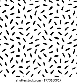 Brush strokes vector seamless pattern. Black paint freehand scribbles, dash lines, dry texture. Chaotic rough smears. Black and white mosaic texture. Hand drawn grunge ink brushstrokes.