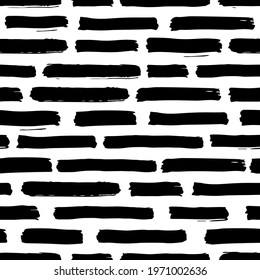 Brush strokes vector seamless pattern. Black and white contemporary pattern with ink stripes. Trendy background for wallpaper and prints. Grunge texture. Minimalistic vector background