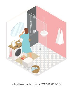 Brush your teeth in the bathroom - vector colorful isometric illustration. A woman in front of a mirror at home is engaged in hygiene. Sink, shower room, washing machine, toilet, tiles, towels
