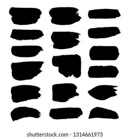 Brushstrokes of hand-drawn black paint isolated on white background