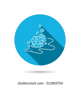 Bubbles icon. Foam for bathing sign. Washing or shampoo symbol. Blue flat circle button with shadow. Vector