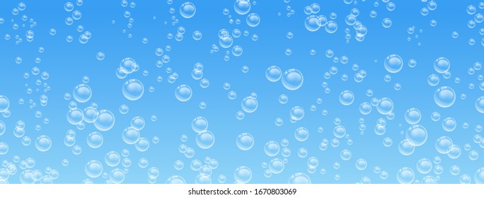 Bubbles in water on blue background 