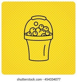 Bucket with foam icon. Soapy cleaning sign. Linear icon on orange background. Vector