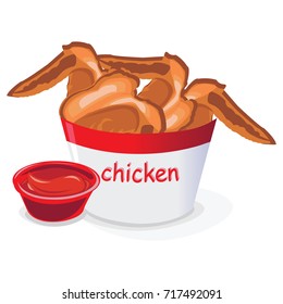Bucket of Fried Chicken wings with tomato sauce