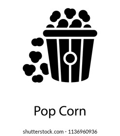 A bucket full of popcorns popping out of it 