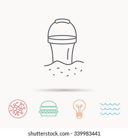 Bucket in sand icon. Trash bin sign. Child beach game symbol. Global connect network, ocean wave and burger icons. Lightbulb lamp symbol.