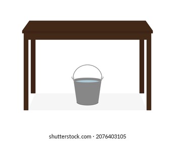 Un cubo de agua se para debajo de la mesa sobre un fondo blanco