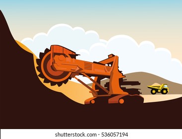 Bucket wheel excavator and truck in a quarry. Heavy mining machinery.