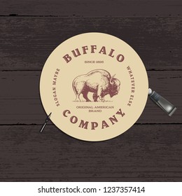 Buffalo Logo design - Workplace concept. Top view with textured table, paint tube and pen nib