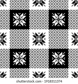 Buffalo plaid pattern Christmas in black and white. Seamless decorative nordic pixel art with snowflakes for tablecloth, gift wrapping paper, other modern festive Scandinavian textile or paper print.