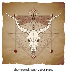 Buffalo skull, dragonfly and Sacred geometric symbol on vintage paper background with torn edges. Abstract mystic sign. Image in sepia and red  color. 