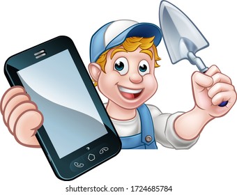 A builder or handyman holding a trowel tool and phone with copyspace