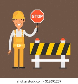 Builder holding stop sign and smiling