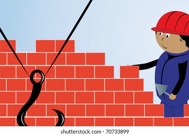 The builder spreads a brick wall