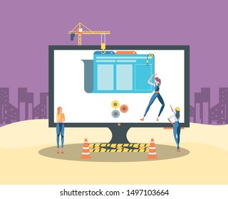 builders and desktop with webpage under cosntruction