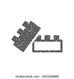 Building blocks icon in grunge texture. Vintage style vector illustration.