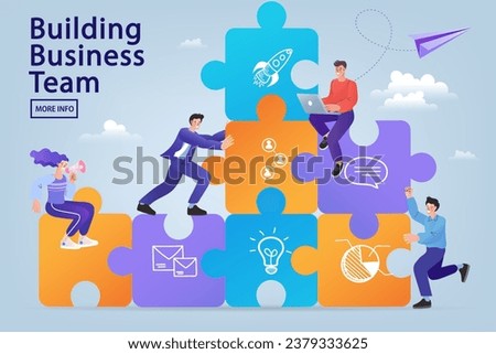 Building a business team and collaboration concept. A diverse group of colleagues assembles a jigsaw puzzle wall with icons, representing a startup, strategy, and a successful corporate structure.