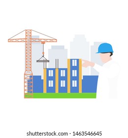 Building the houses with construction machines. The engineer on the building place.