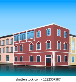 building on the street with a channel and reflection