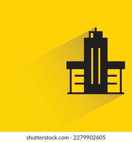 building with shadow on yellow background