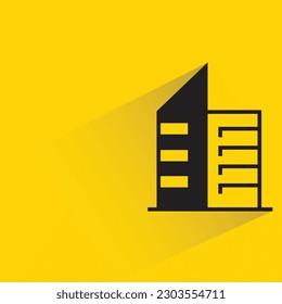 building with shadow on yellow background