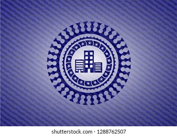 buildings icon inside badge with denim background