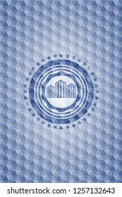 buildings icon inside blue emblem with geometric pattern.