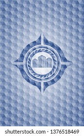buildings icon inside blue emblem with geometric background.
