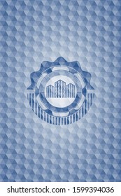 buildings icon inside blue emblem or badge with geometric pattern background.