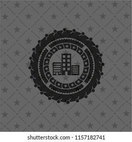 buildings icon inside dark badge or emblem
