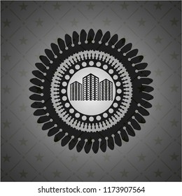 buildings icon inside dark badge or emblem
