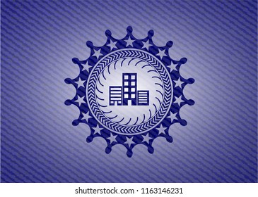 buildings icon inside emblem with denim texture