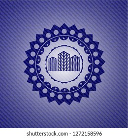buildings icon inside emblem with denim texture