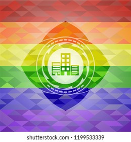 buildings icon inside emblem on mosaic background with the colors of the LGBT flag