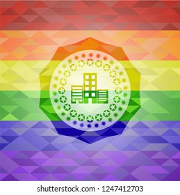 buildings icon inside emblem on mosaic background with the colors of the LGBT flag