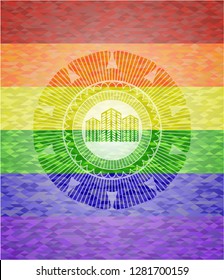 buildings icon inside emblem on mosaic background with the colors of the LGBT flag