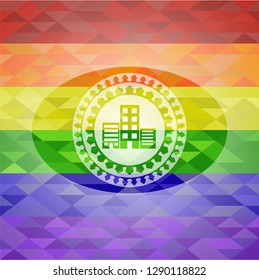 buildings icon inside emblem on mosaic background with the colors of the LGBT flag