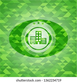 buildings icon inside green mosaic emblem
