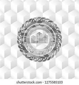 buildings icon inside grey badge with geometric cube white background